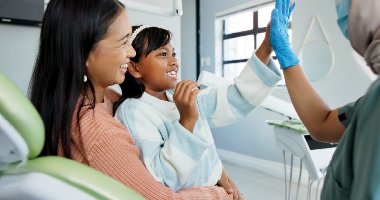 Children's dentist with young patient